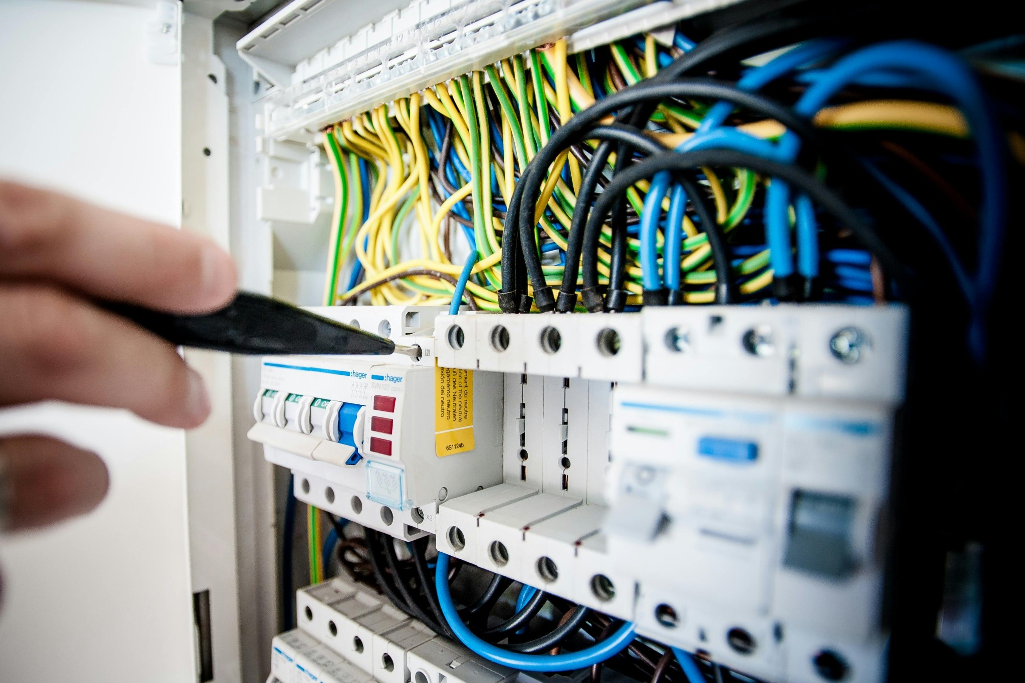 Electrician working on an electrical distribution board